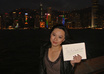 take photos holding your sign in front of Victoria Harbour, Hong Kong small2