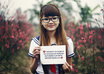 dress up a COSPLAY at cherry blossom field and take nice pictures holding a handwritten sign of your website or business small2