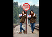 take a multi exposure photo of me holding your message and your logo in traffic signs small2