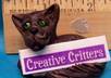 make a cute cat sculpture holding your logo, business name, or short message small2