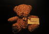 draw your logo and write your message on a piece of paper and take pictures of teddy bears holding it small2