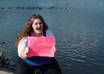 take 3 high resolution photos of my girlfriend holding a sign to promote your message small3
