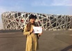 take a photo holding a handwritten sign for you standing in front of the Beijing Olympic Birds Nest Stadium small1