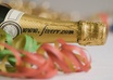 write your website name on the neck of a champagne bottle small1