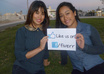 send you 3 photos of me and my twin sister, holding your sign small1