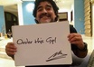 take a picture of Diego Maradona holding a sign of your website or business