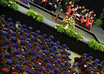 print and distribute flyers at the Duquesne University graduation