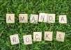 arrange Scrabble tiles to form a message lush, green grass and send you a high res photo small1