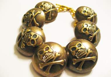 send you one skull and crossbones button bracelet big1