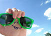 send you a photo of me holding my sunglasses the way in the photo with any messages on my hand against the sky