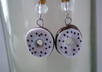 make a pair of  polymer clay chocolate donuts with white icing earrings