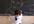 make a small girl drawing your image in a blackboard just