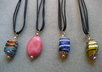 send you one beaded pendant on double strand black cord to US address only