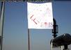 write your message on my white flag and make it fly from top buildings small1