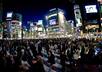 cross Tokyo Shibuya scramble crossing holding a sign of your website/product/logo