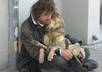 give a loaf of bread to a homeless person
