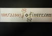 create a book mark with an inversed word with gold metallic paint for emphasis