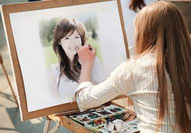 make your any photo appear as a girl is painting it with water colors in a street big1