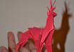 make 2 small  origami red nose reindeer